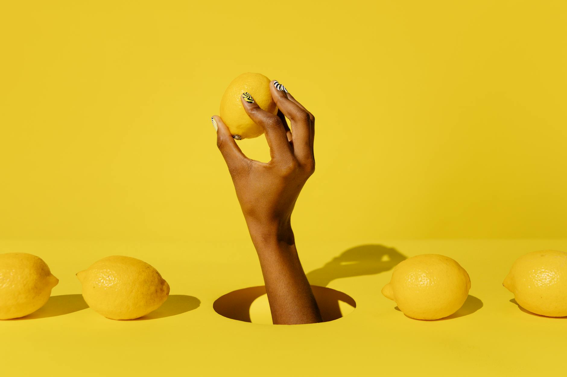 Bright yellow lemons arranged on a soft background, symbolizing renewal and fresh sensation