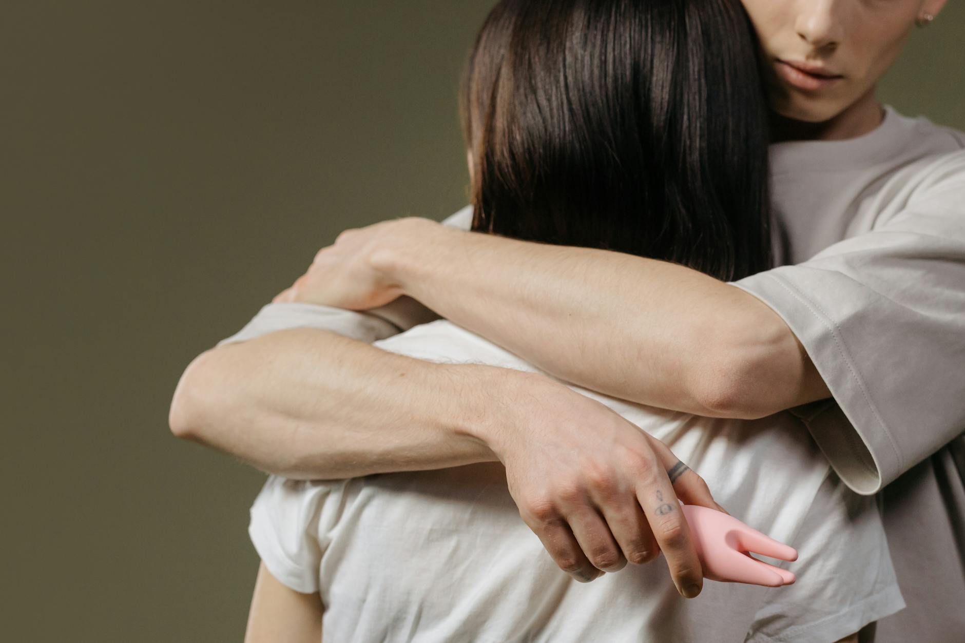 A couple embracing intimately, representing reconnection after postpartum recovery.